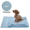 Three blue cooling dog mats in varied sizes with breathable bubble backing; puppy sits on top.