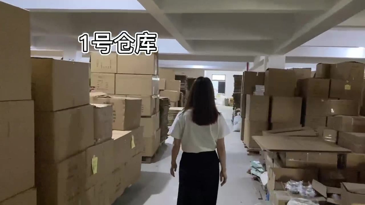 Pet slow food bowl packaging in a warehouse, with tall stacks of cardboard boxes and a person walking down an aisle