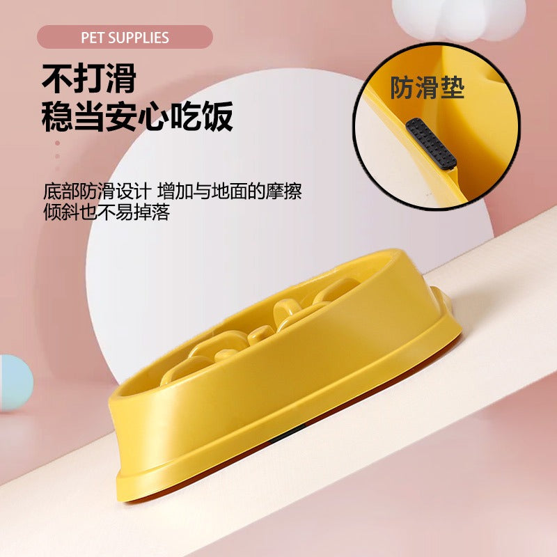 Yellow pet slow-food dog bowl with non-slip base and ridged interior.