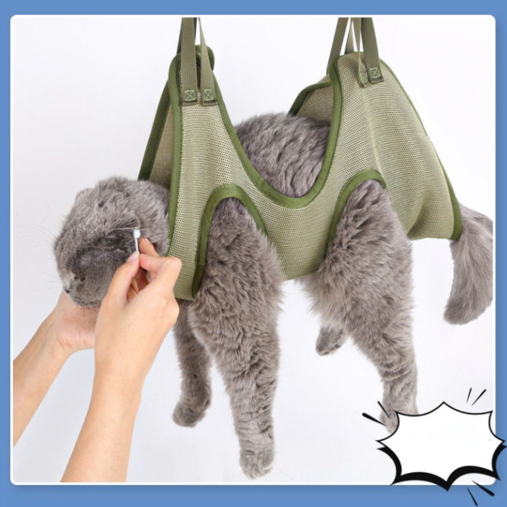 Cat grooming restraint bag with hammock in green mesh fabric.