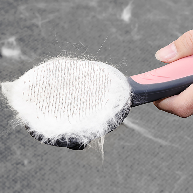 Pet grooming cat and dog comb brush with pink and gray handle and white bristles